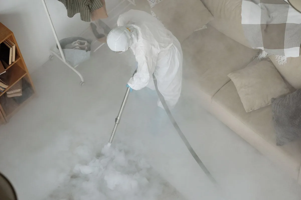 Biohazard cleanup technician in protective equipment, Grixdale Farms, Detroit, MI